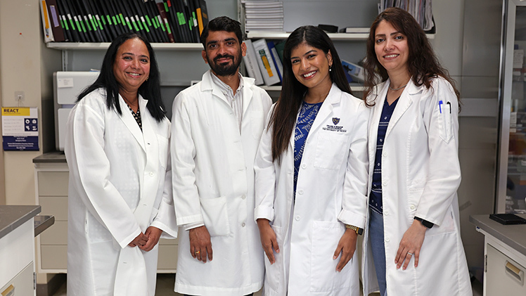 Portrait of From left, Dr. Sailaja Paruchuri, a professor in the Department of Physiology and Pharmacology; Dr. Lakshminarayan Reddy Teegala, an assistant professor in the Department of Physiology and Pharmacology; and doctoral students Emma Elizabeth Sabu-Kattuman and Somayeh Darzi.