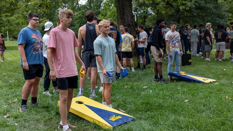 Zachary Green, a freshman computer science major and Brady Losie, freshman mechanical engineering major, play cornhole at last night's bonfire.