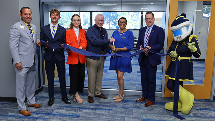Jason Toth, from left, senior associate vice president for administration; Jaden Bollinger, vice president of Student Government; Iryna Snahoshchenko, president of Student Government; Dr. James Holloway, president of UToledo; Angelica Johnson, director of TRIO Student Support Services; and Dr. Mitchell McKinney, provost and executive vice president of academic affairs, participated in the ceremony and celebration.
