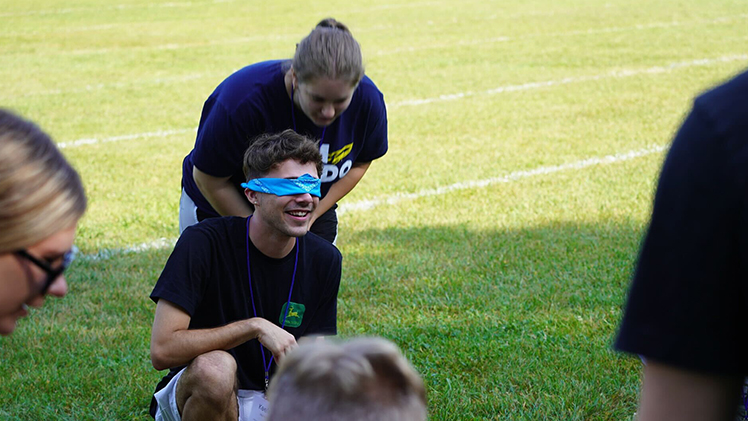 During the weekend at Camp Storer, Olivia Lombard, a pre-nursing freshman from Dayton, and Keefe Carter, a freshman majoring in biochemistry and chemistry from Dayton, enjoy one of the team building activities.