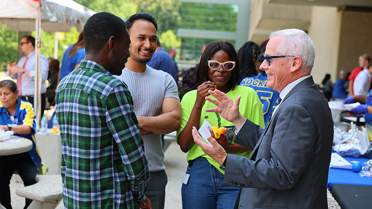 UToledo President James Holloway chats with Employee Appreciation Summerfest attendees.