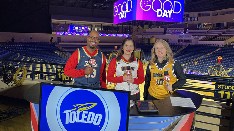 Steven Jackson, left, a longtime reporter and anchor for WTOL 11, joined colleagues Amanda Fay and Kaylee Bowers for a production of Good Day at UToledo’s Savage Arena in 2024.