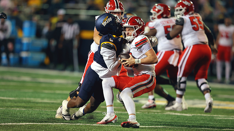 Safety Jaden Dottin sacking Western Kentucky's #7 Maverick McIvor.