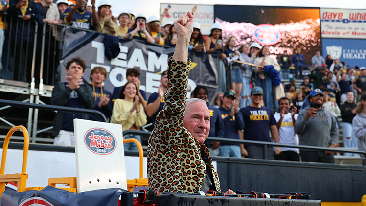 UToledo President James Holloway celebrates as he became the first fan to be dunked in the 2025-26 football season in the "Touchdown Tank."
