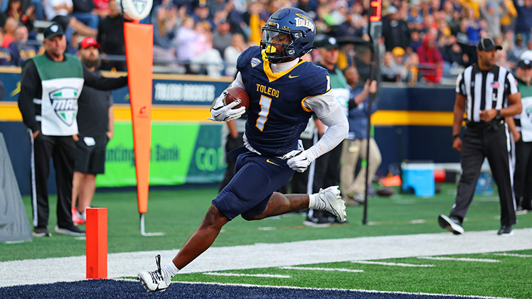 UT senior running back Chip Trayanum runs for a touchdown.