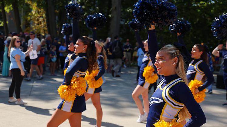 Cheerleaders perform at the William and Carol Koester Alumni Pavilion.