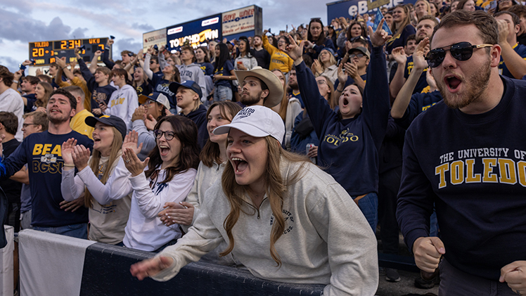 UToledo students scream for the Rockets during a game at the Glass Bowl.