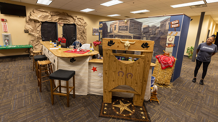 Academic Success and Engagement's setup earned second place in the Homecoming Office Decorating Competition, impressing judges with its saloon atmosphere. 