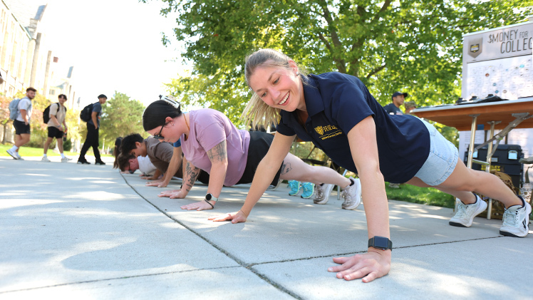 Elizabeth Crosley, right, a sophomore transfer student in nursing, joins Madison McKitrick, a graduate student studying speech-language pathology, in the 7th Annual 22 Pushup Challenge on Thursday, Sept. 11, near the Veterans Memorial Plaza on Main Campus. Hosted by the Military Service Center, the event was to help to raise awareness about the mental health challenges faced by veterans.
