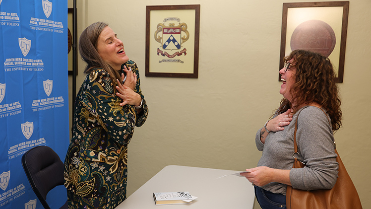 Author Lauren Groff reacts while meeting Toledoan Erin Marten at a book signing following the 2025-26 Edward Shapiro Distinguished Lecture Series