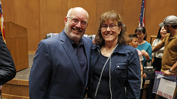 Dr. Patrick Lawrence, professor and chair of the Department of Geography and Planning, and his wife Nancy, an admission analyst in the Office of Undergraduate Admissions, were among the 38 people naturalized during a ceremony at the Law Center on Friday, Sept. 12.