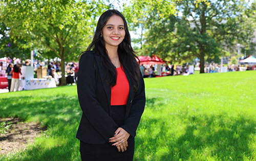 Saakshi Risam, who is in the pre-physical therapy track and plans to pursue a doctor of physical therapy degree after earning her bachelor’s, cposes for a photo outside on the UToledo campus.