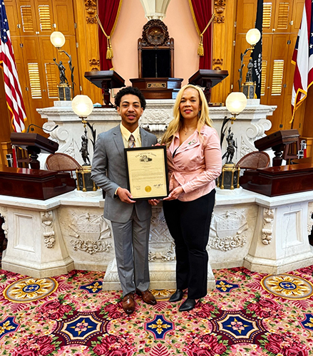 Freshman engineering student Tyreese Blue II was recently selected National Youth of the Year by the Boys and Girls Club of America. He is posing with an award at the Ohio Statehouse. 