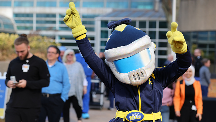 Photo of Rocksy dancing at the President’s Backyard Barbecue at HSC.