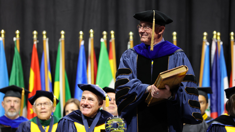 Holloway holds The University of Toledo’s Articles of Incorporation, dating back to the University’s founding on Oct. 12, 1872, as part of his official installation as UToledo’s 19th president.