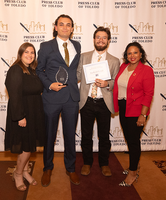 From left, Jess Delaney, production studio coordinator in the Department of Communication and Media; seniors Trip Floyd and Asa Kridelbaugh, each holding their award; and Tisha Mays, an assistant lecturer in the Department of Communication and Media, pose for a photo at the Press Club of Toledo Touchstones Awards.