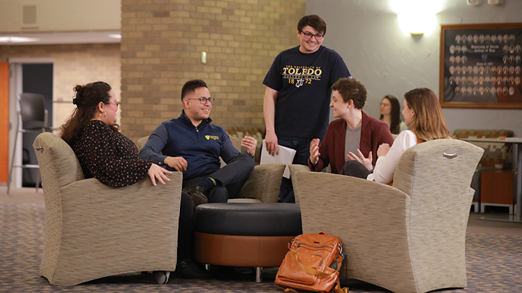 Marketing stock photo of UToledo College of Law students engaged in a group study session.