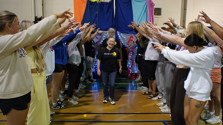 Members of Sigma Alpha Epsilon and Alpha Omicron Pi form a spirit tunnel for members of 1Matters, the organizers of Tent City.