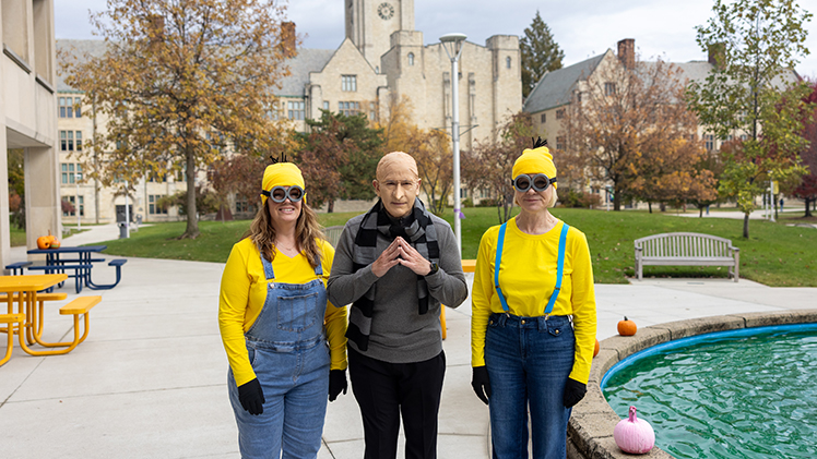 UToledo President James Holloway as Gru, center, poses with his Minions, Traci McDaniel, left, executive assistant of senior administrative operations, and Gail Simpson, right, executive assistant and business manager.