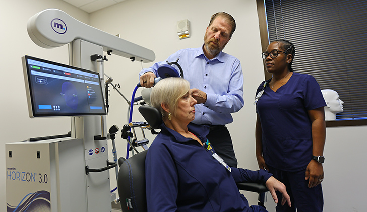 From left, Michelle Harris, clinical coordinator for TMS; Dr. Rob Smith, a UToledo Health psychiatrist; and Rosalyn Morehead, the outpatient clinical supervisor for psychiatry. 