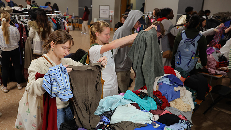 Maddy Torrell, left, and Lauren Zanotelli, both sophomores in environmental engineering, check out clothes at the Rocket Thrift Shop.