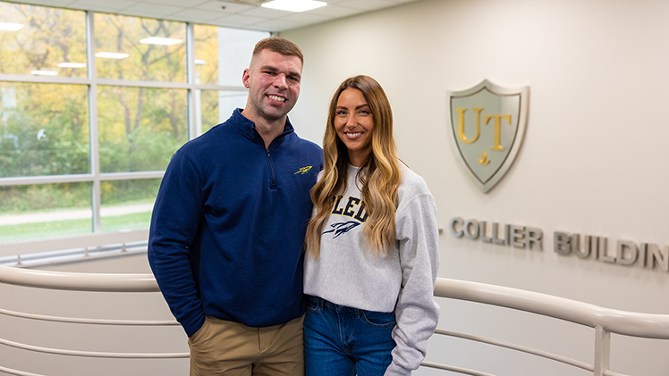 Photo of newlyweds Conner Buraszeski and Ali Buraszeski, who are balancing graduate nursing school, demanding full-time jobs and married life, all while preparing to walk across the stage together on May 2.