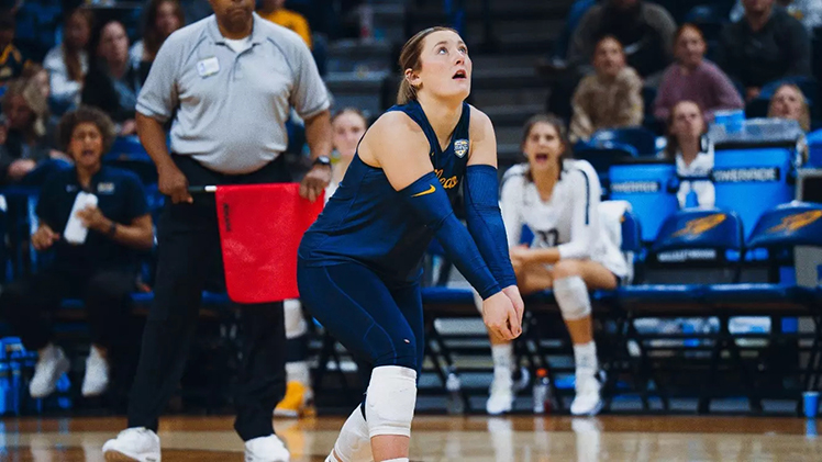 Photo of sophomore libero Grace Freiberger, a Rocket volleyball player who was named the MAC Defensive Player of the Year and earned All-MAC First Team honors, as she prepares to hit the ball.