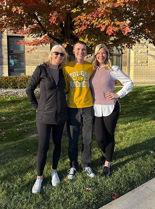 Grayson Gallaher, center, with his grandmother, Rebecca Dudley, left, and mother, Diana Fox Gallaher, right, all of whom represent three of the five generations of educators in their family who attended UToledo.