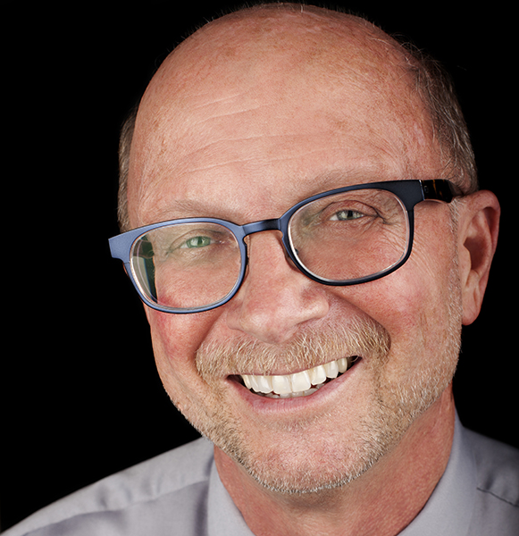 Headshot of Dr. Jo-Michael Scheibe, a professor emeritus of choral music at the University of Southern California Thornton School of Music.