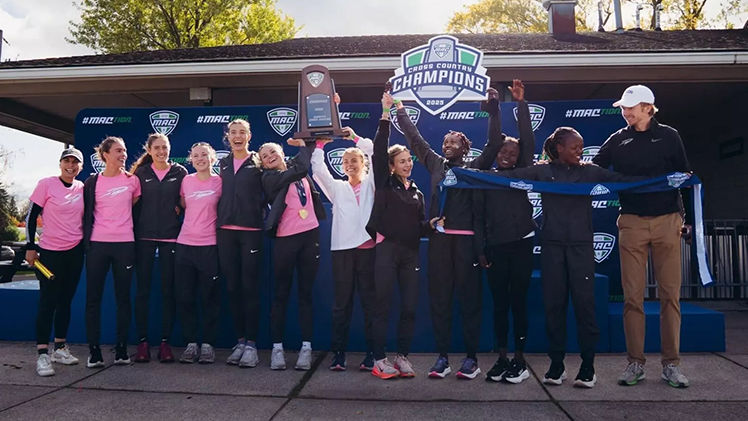 Group photo of the Toledo Women's Cross Country team celebrating after its fifth-consecutive Mid-American Conference Women's Cross Country Championship in Buffalo, New York, on Saturday.