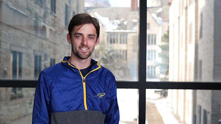 Portrait of graduating COBI student Dylan Paule.