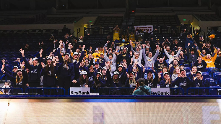 Toledo women's volleyball players and fans celebrate at Savage Arena on Sunday after learning the team will be playing in its first-ever NCAA tournament. 