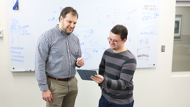 Dr. Eli Visbal, an associate professor of astronomy, left, worked with Ryan Hazlett, a doctoral student in physics, on new research proposing the first direct detection of Population III stars. 