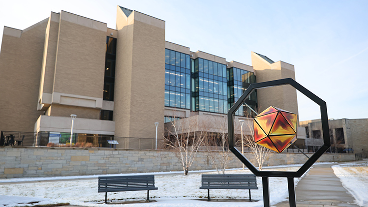University Photographer Dan Miller captured this image of clashing angles and lines between the installation Icasahedron and the east side of Carlson Library.