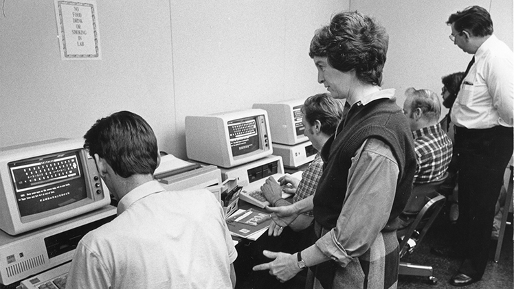 Students get help in The University of Toledo Computer Lab, circa 1983–’84, featuring what were then state-of-the-art IBM Personal Computer (Model 5150) workstations.