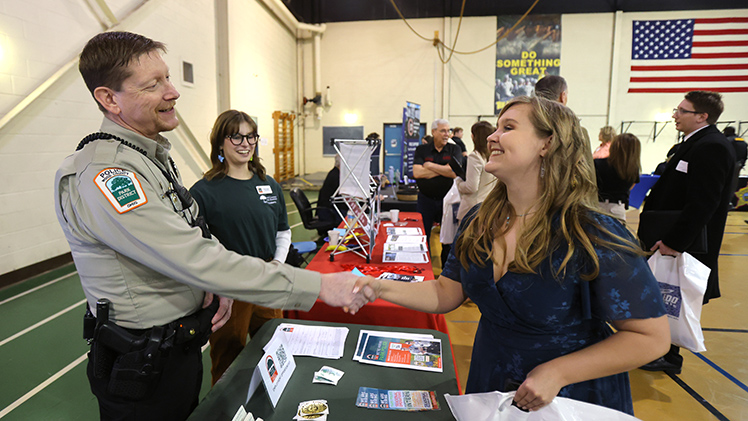 Eric Shiffler, left, a sergeant with Wood County Park District Police, Taylor Vanek, a communications assistant with Wood County Park District, meet with Annie Rush, a senior studying criminal justice.