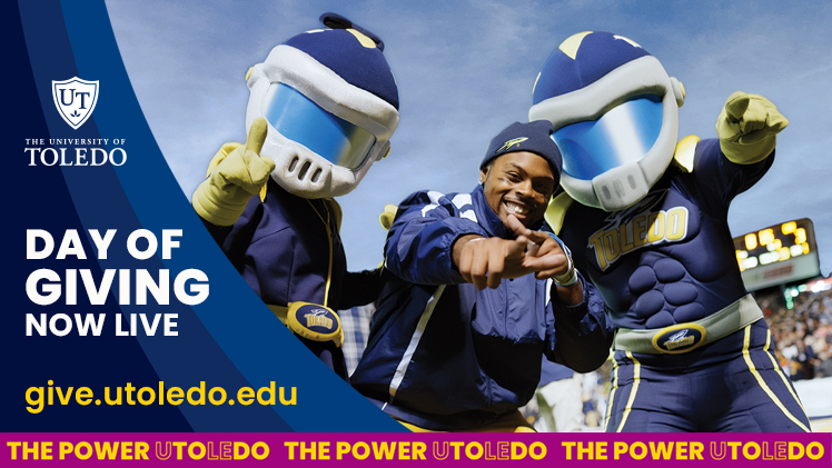 A promotional graphic for The University of Toledo’s largest annual campaign, Rocket Forward Day of Giving, from 6 a.m., Wednesday, Feb. 18, through 6 p.m. Thursday, Feb. 19. There is a photo of Rocky, Rocksy and a student inside the Glass Bowl.