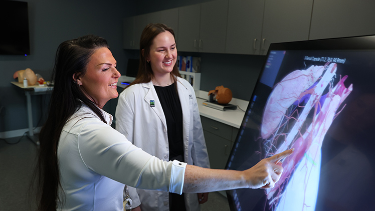 Emma Bonnell, right, works with Julie DeSantis, director of the Transplantation and Donation Sciences program. Bonnell enrolled in the Transplantation and Donation Sciences master’s program last fall and is on track to graduate this summer.