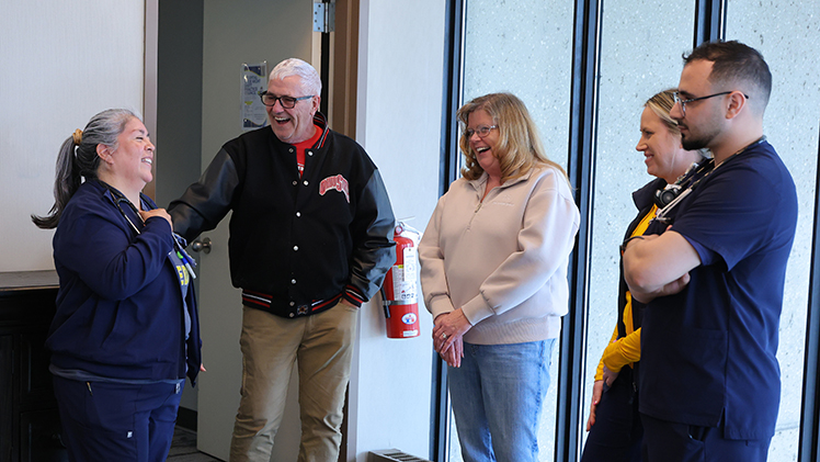 From left, Leslie Caputo, a registered nurse at UTMC; Michael Damschroder and his wife, Paula Damschroder; Alexa Mcnamee, nurse assistant director at UTMC; and Yazin Abulkareem, a registered nurse. With Michael fully recovered from a stroke he had in September, he and his wife reunited with members of his UTMC healthcare team, who not only cared for him, but helped the couple with a small wedding ceremony at the hospital.