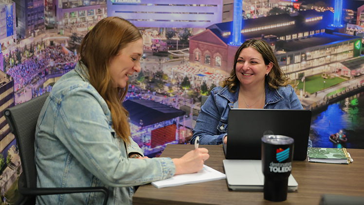 Alyssa Stoy takes a meeting with Caleigh Heuring, director of marketing & destination engagement for Destination Toledo.