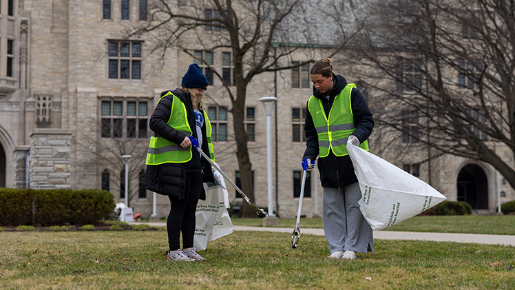 Kamryn Stripp, left, an electrical engineering student, and Caroline Rusinoff, a nursing student, clean up Main Campus as part of Saturday’s BIG Event.