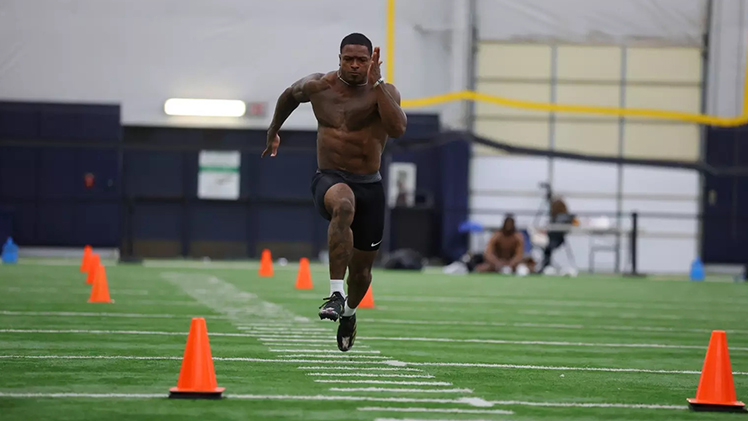 Running back Chip Trayanum runs in a drill as one of 14 Rockets who participated in Pro Day on Monday.