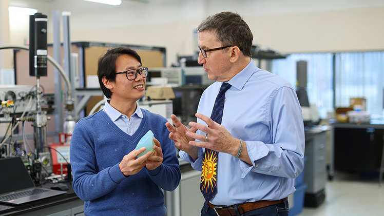 Dr. Donghui Zhao, left, a materials scientist and glass expert, collaborates with Dr. Michael Heben, a Distinguished University Professor and McMaster Chair and Director of the Wright Center for Photovoltaics and Commercialization.
