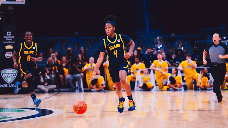 Kendall Carruthers dribbles the ball. She scored 16 points and was 3-of-4 from three in Toledo's victory over UMass.