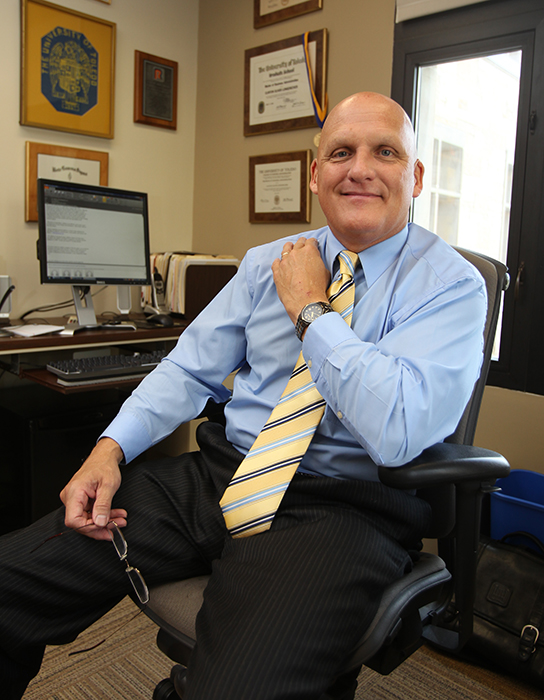 In-office photo of Clinton “Clint” Longenecker, a Distinguished University Professor of Leadership Excellence Emeritus in the John B. and Lillian E. Neff College of Business and Innovation.
