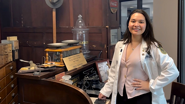 Photo of UToledo Pharm.D. student Michelle “Mimi” Bordignon standing in a pharmacy office. 