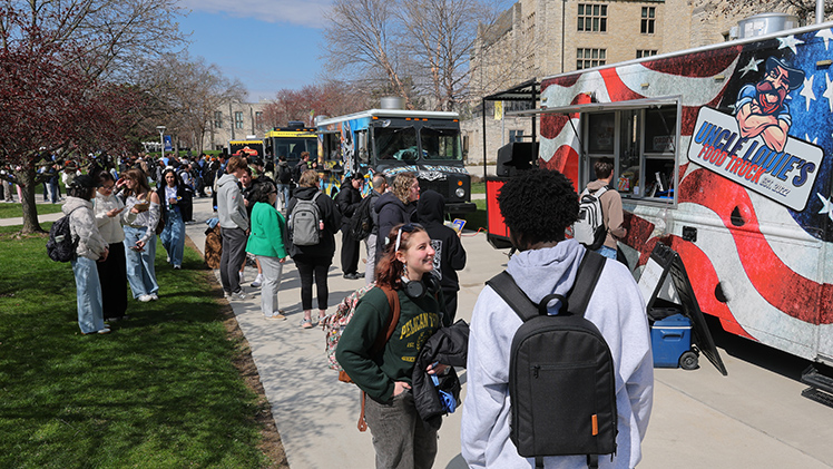 Rockets enjoy the sunshine and lunch at Wednesday’s Student Appreciation Day on Centennial Mall. The event, part of the RocketFest 2026 weeklong celebration of UToledo students, included food trucks, interactive activities and T-shirts.
