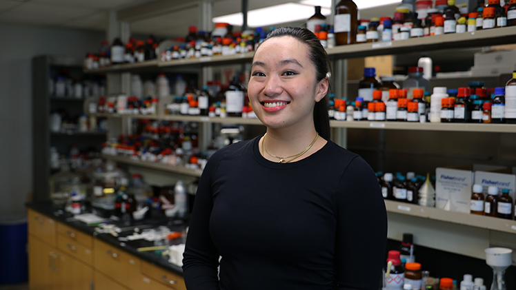 Portrait of UToledo student Victoria Ho posing in her research lab.