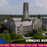 Stock arial photo of University Hall with the words "Annual Report FY26."