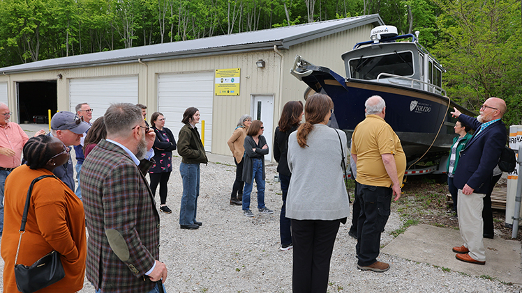 Dr. Thomas Bridgeman, director of The University of Toledo Lake Erie Center and professor in the Department of Environmental Sciences (far right), leads members of the International Joint Commission Water Quality Board on a tour of the Lake Erie Center facilities in Oregon, Ohio.